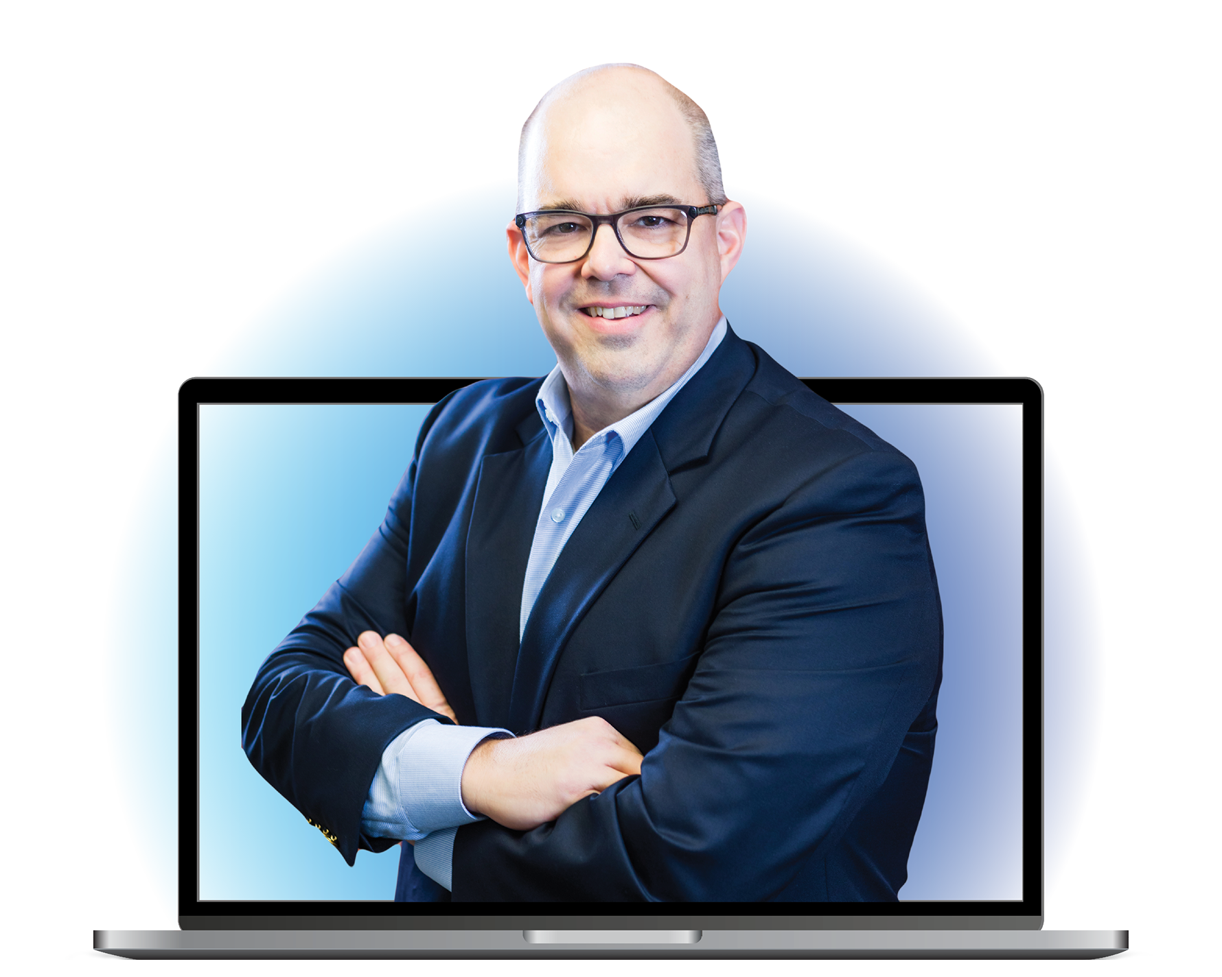 Don McDaniel posing arms crossed in front of a computer